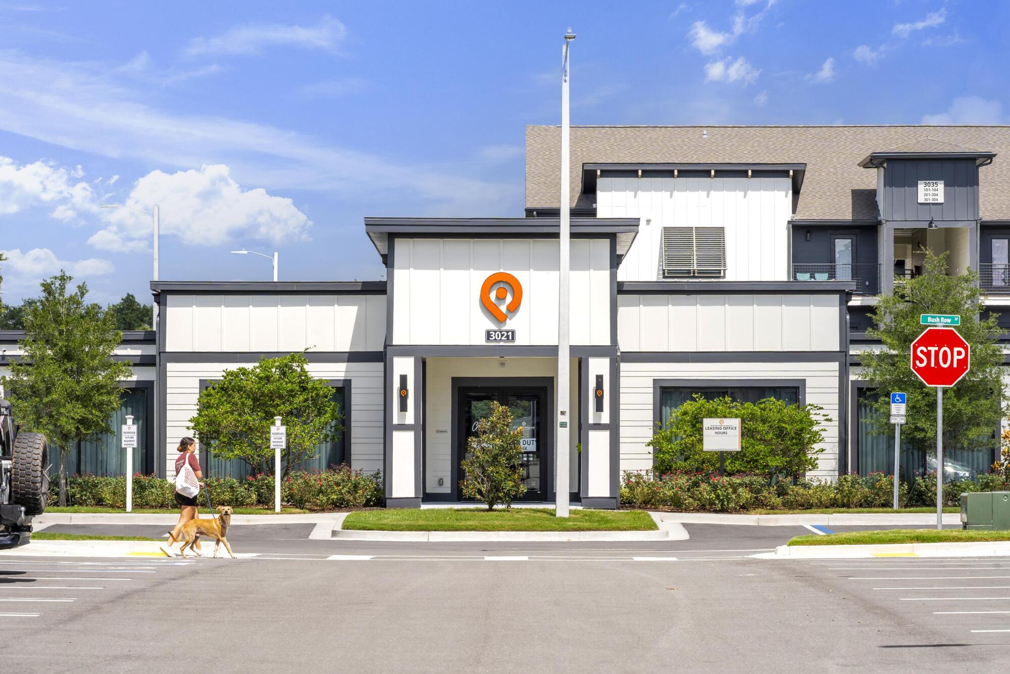 Front exterior view of the main clubhouse and leasing center at Pointe Grande Plant City.