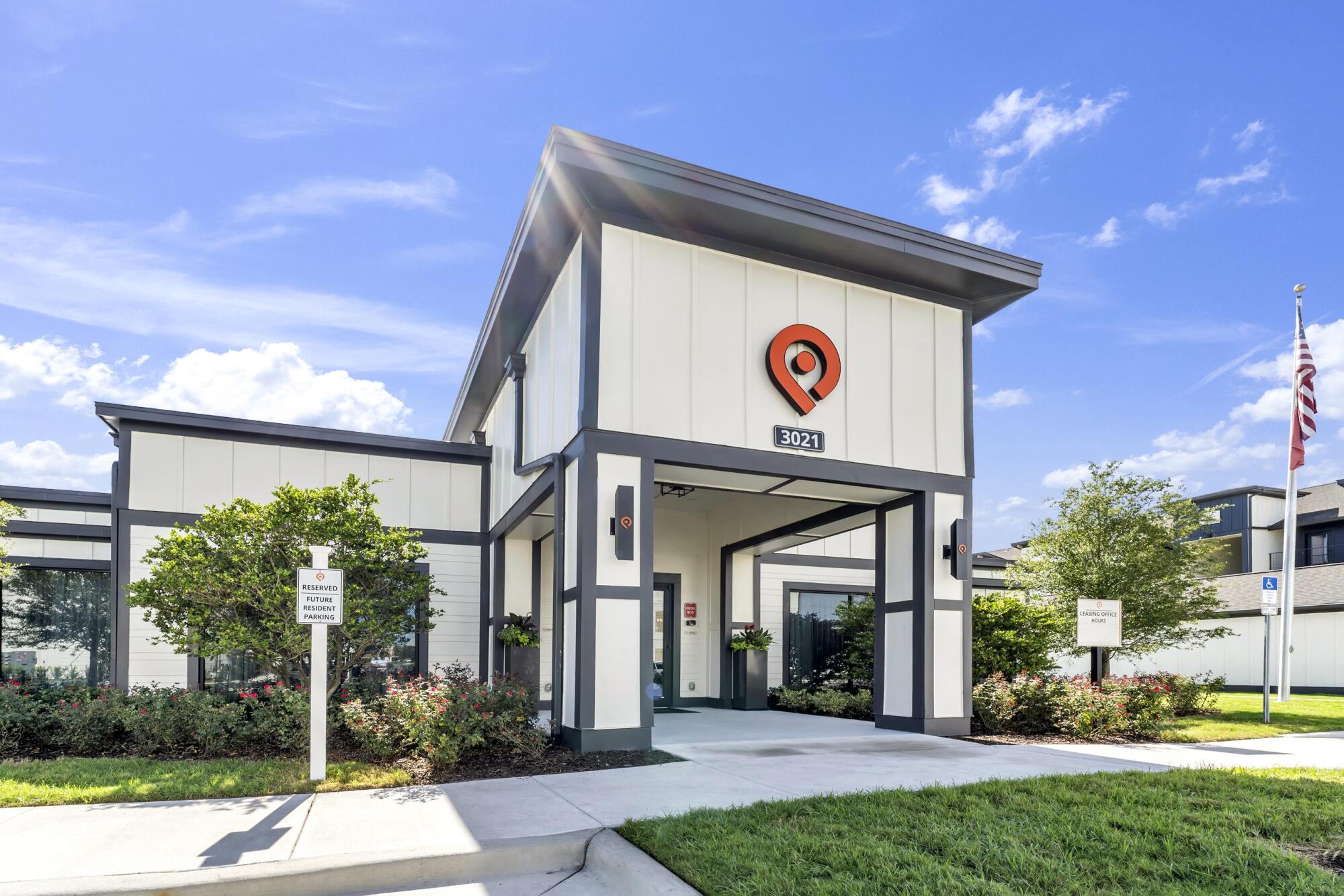 Leasing office entrance door at Pointe Grande Plant City featuring the community logo.