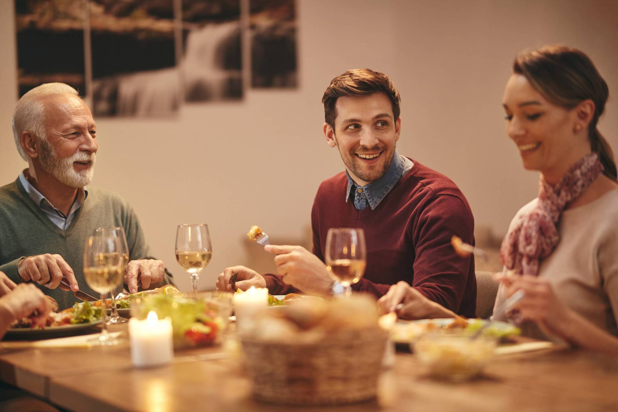 Friends having dinner, smiling