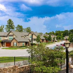 Townhomes at Chapel Watch Village community exterior with beautiful trees and spacious, quiet roads