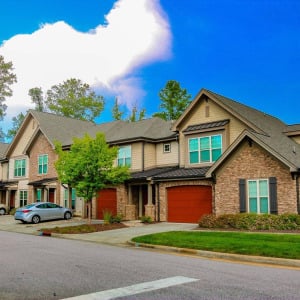 Townhomes at Chapel Watch Village community exterior with beautiful trees and spacious, quiet roads