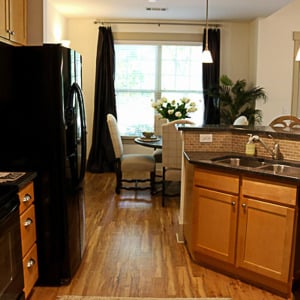 Townhomes at Chapel Watch Village townhome kitchen with an island and floor-to-ceiling cabinets