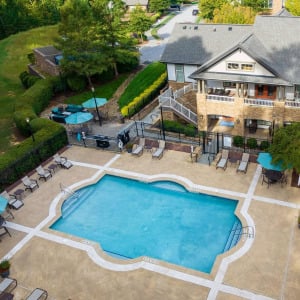 Townhomes at Chapel Watch Village community amenities aerial of saltwater pool, clubhouse, and surrounding grass and trees