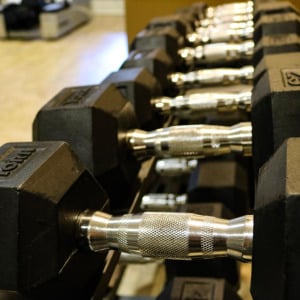 Townhomes at Chapel Watch Village community amenities with a state-of-the-art fitness center with dumbbells