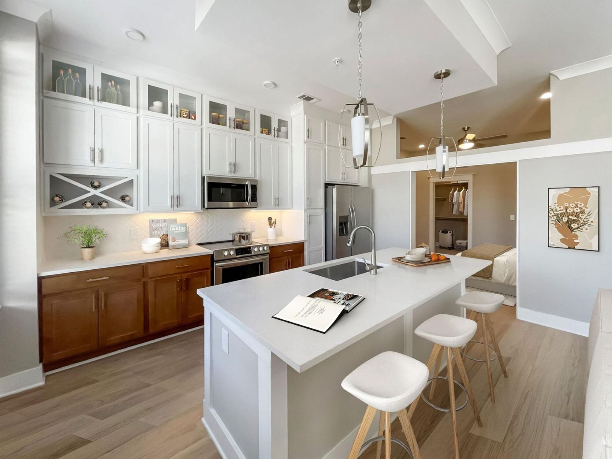 Designer kitchen with floor to ceiling cabinets and a brown white finish