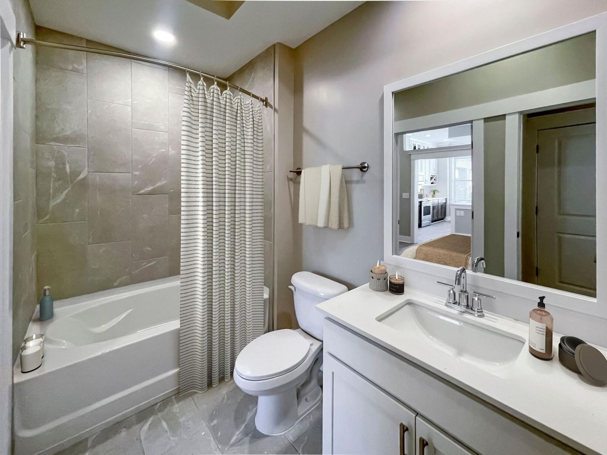 Bathroom featuring a sink and large tub