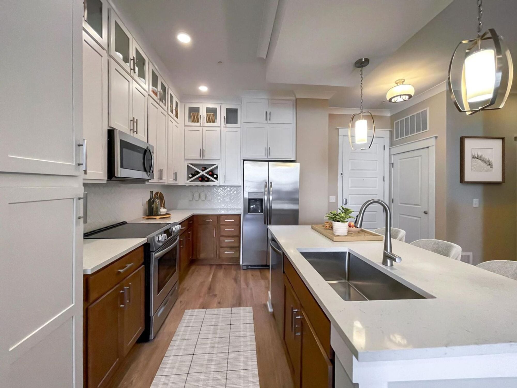 A6 kitchen with built-in wine racks and floor to ceiling cabinets