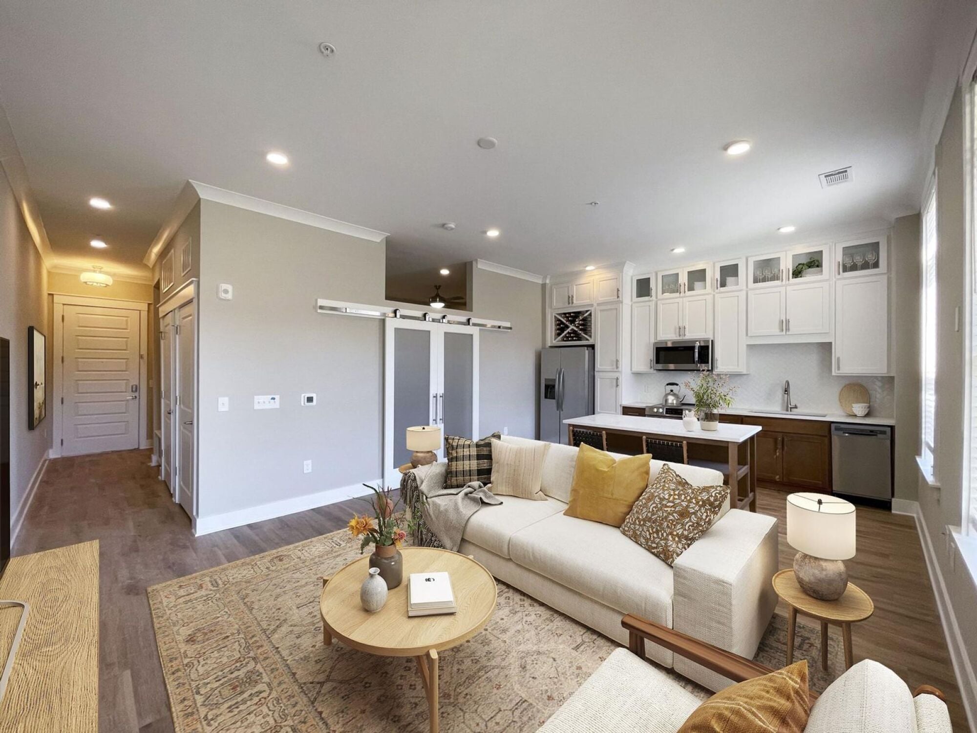 A3 open concept living room with barn doors