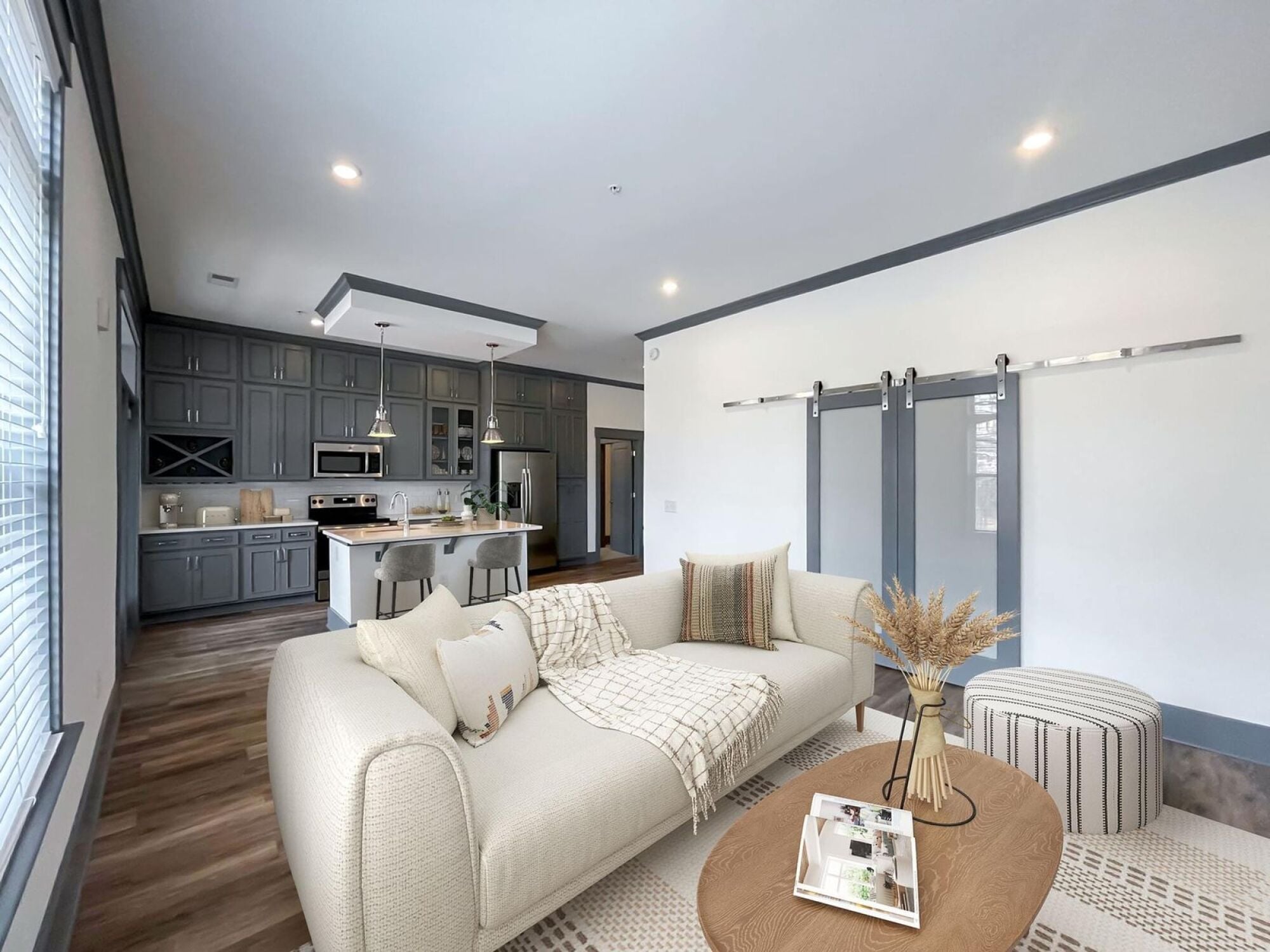 Ravenswood open concept living room featuring barn doors