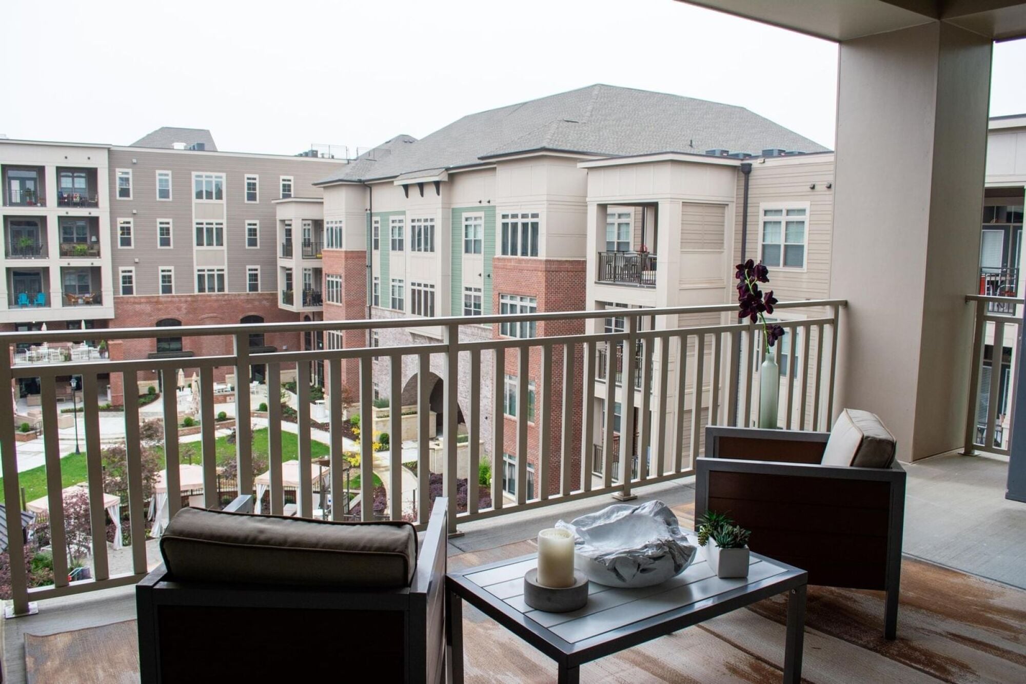Balcony view of courtyard surrounded by apartment units