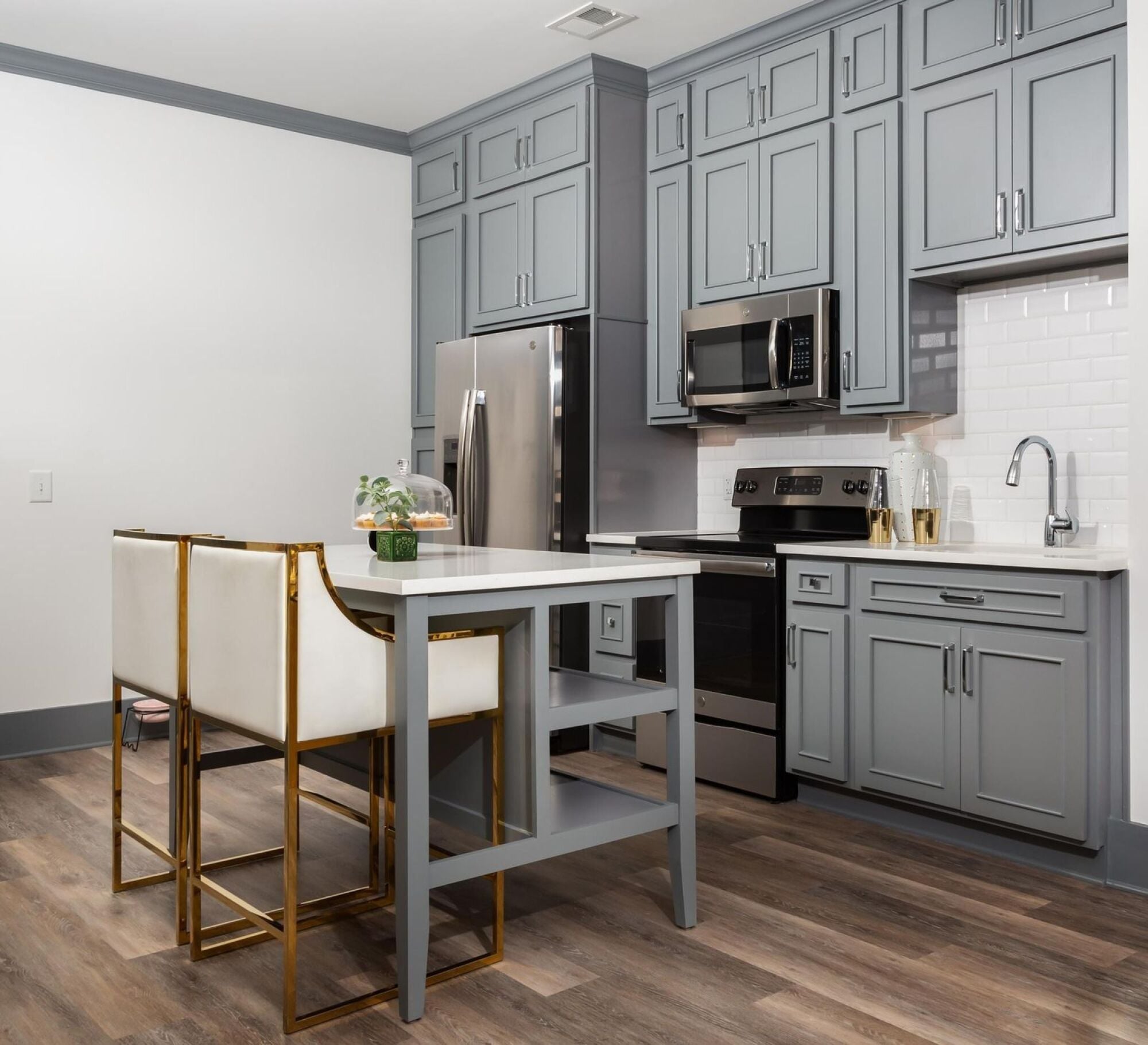 Open concept kitchen with island and floor to ceiling cabinets