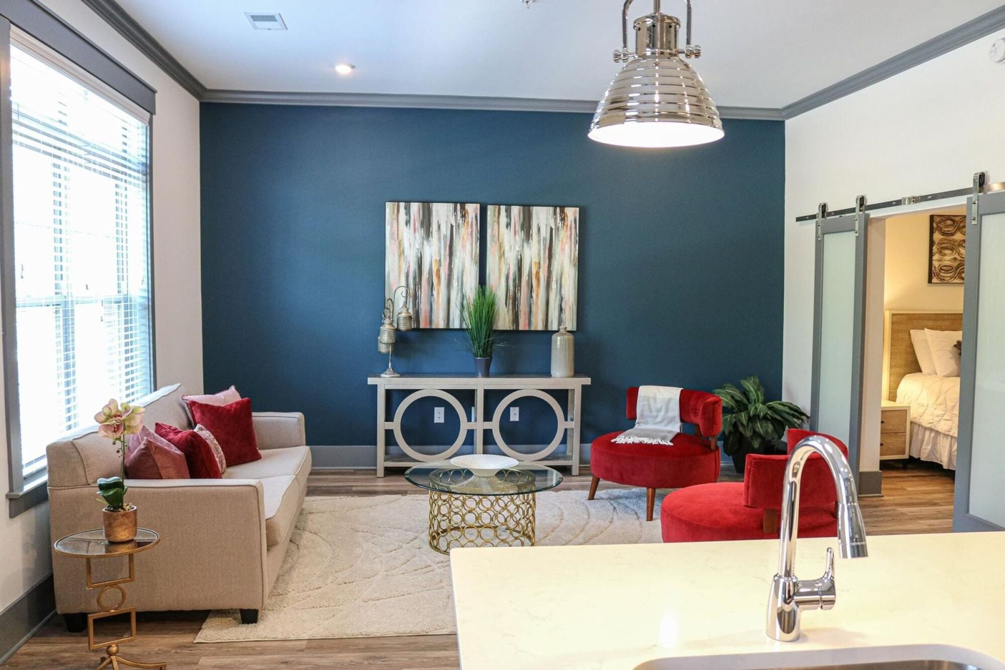 Living area with accent wall and barn door