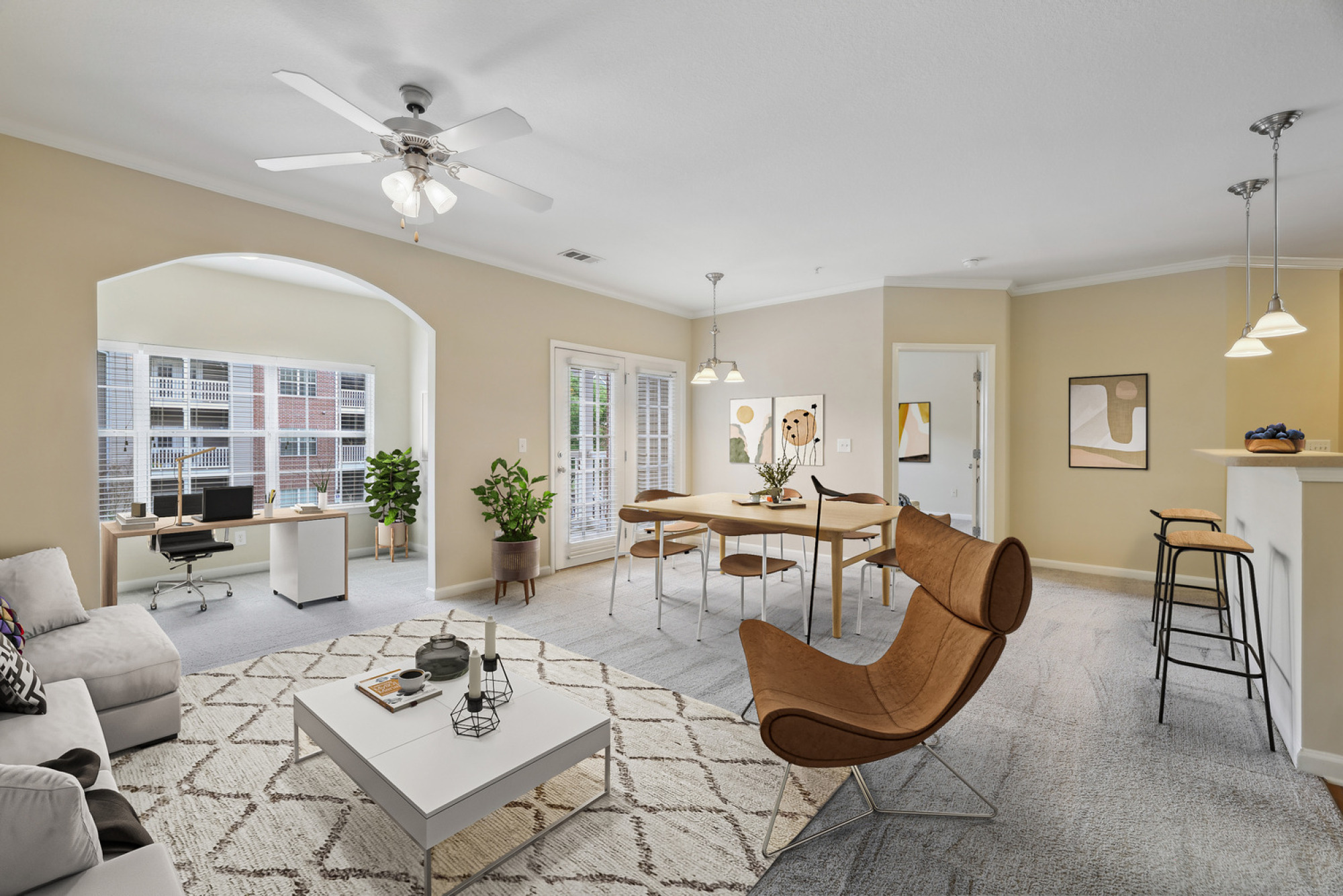 Large floorplan living and dining space at Walker's Crossing featuring architectural archways.