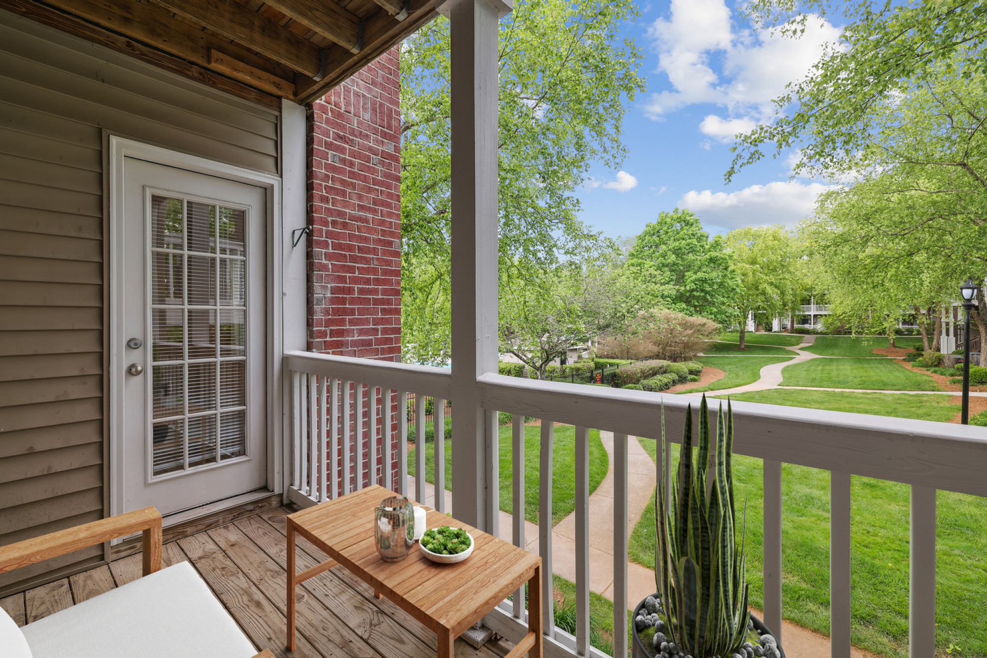 Private screened-in porch at Walker's Crossing offering a relaxing outdoor living space.