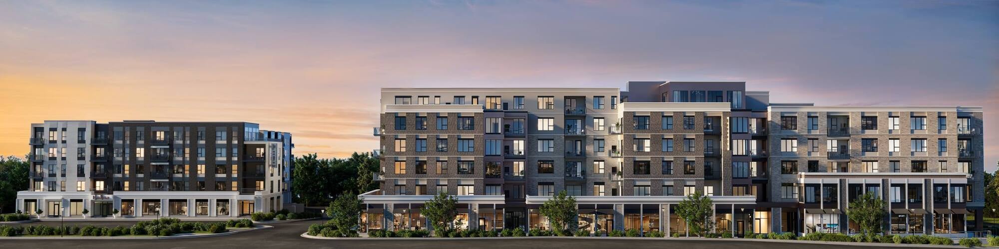 Modern multi-story apartment buildings at sunset with large windows and street-level shops, surrounded by greenery.