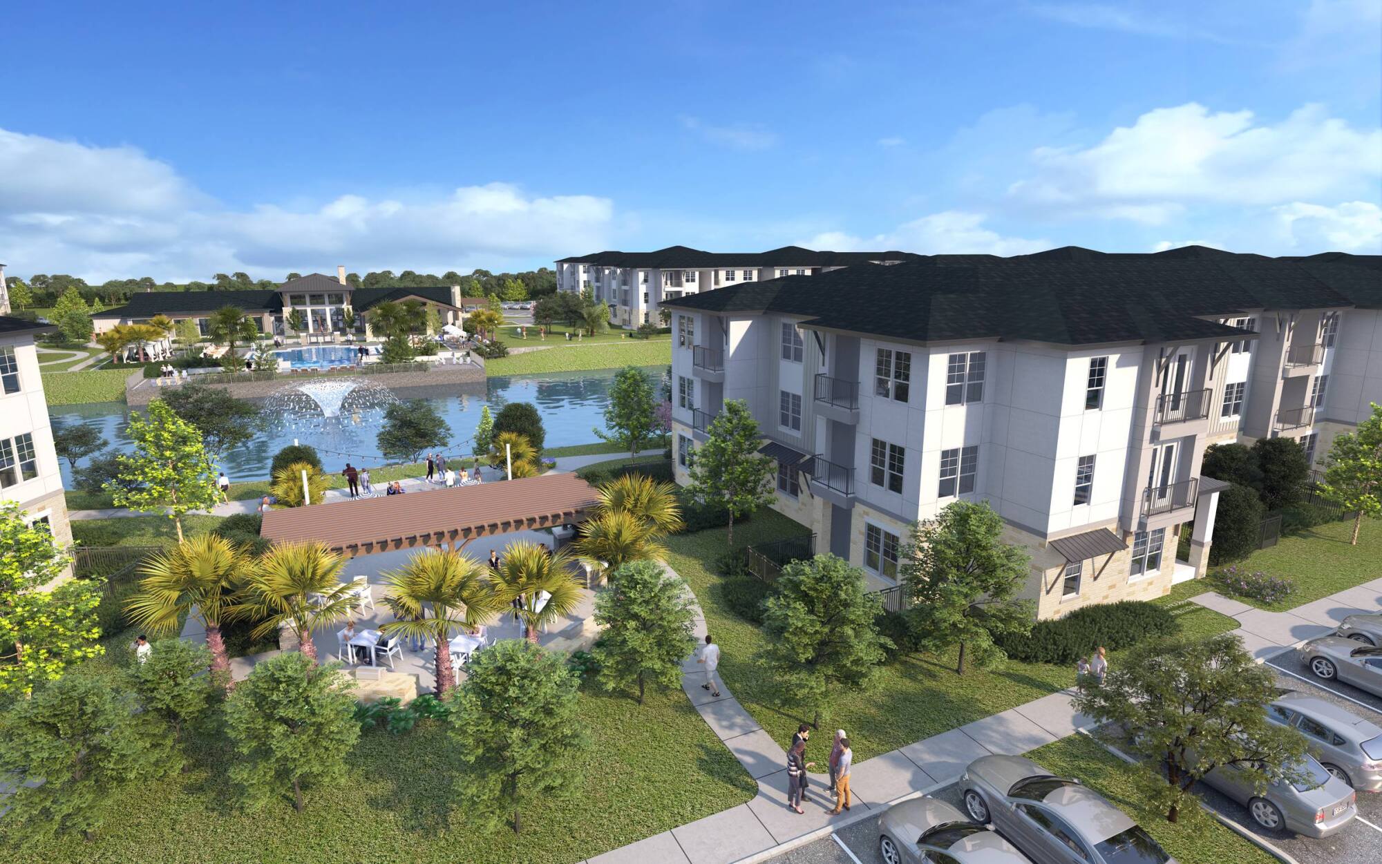 A modern apartment complex with a lake, pool, greenery, parked cars, and people walking outdoors.