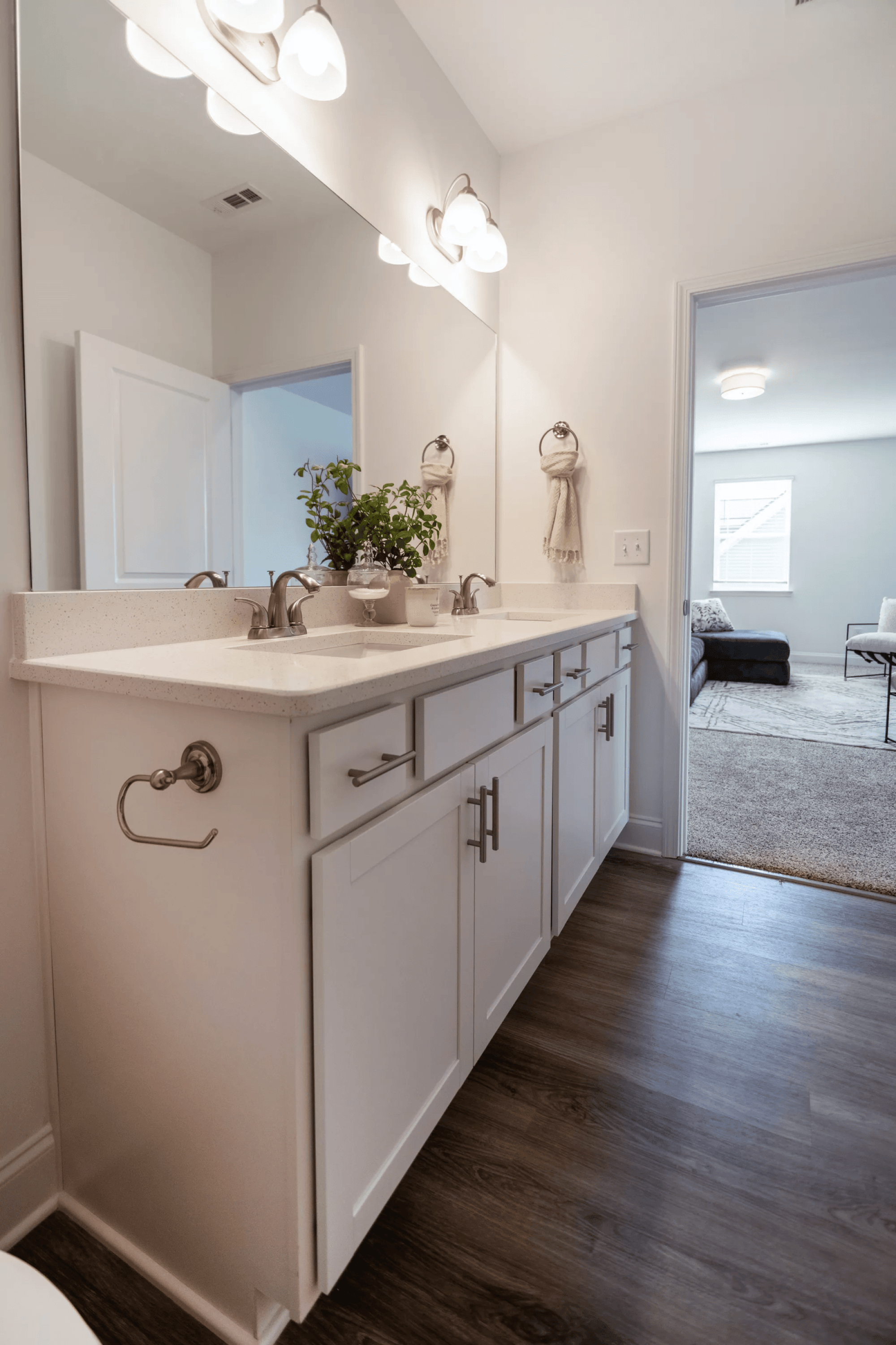 A bathroom with a vanity and a mirror.