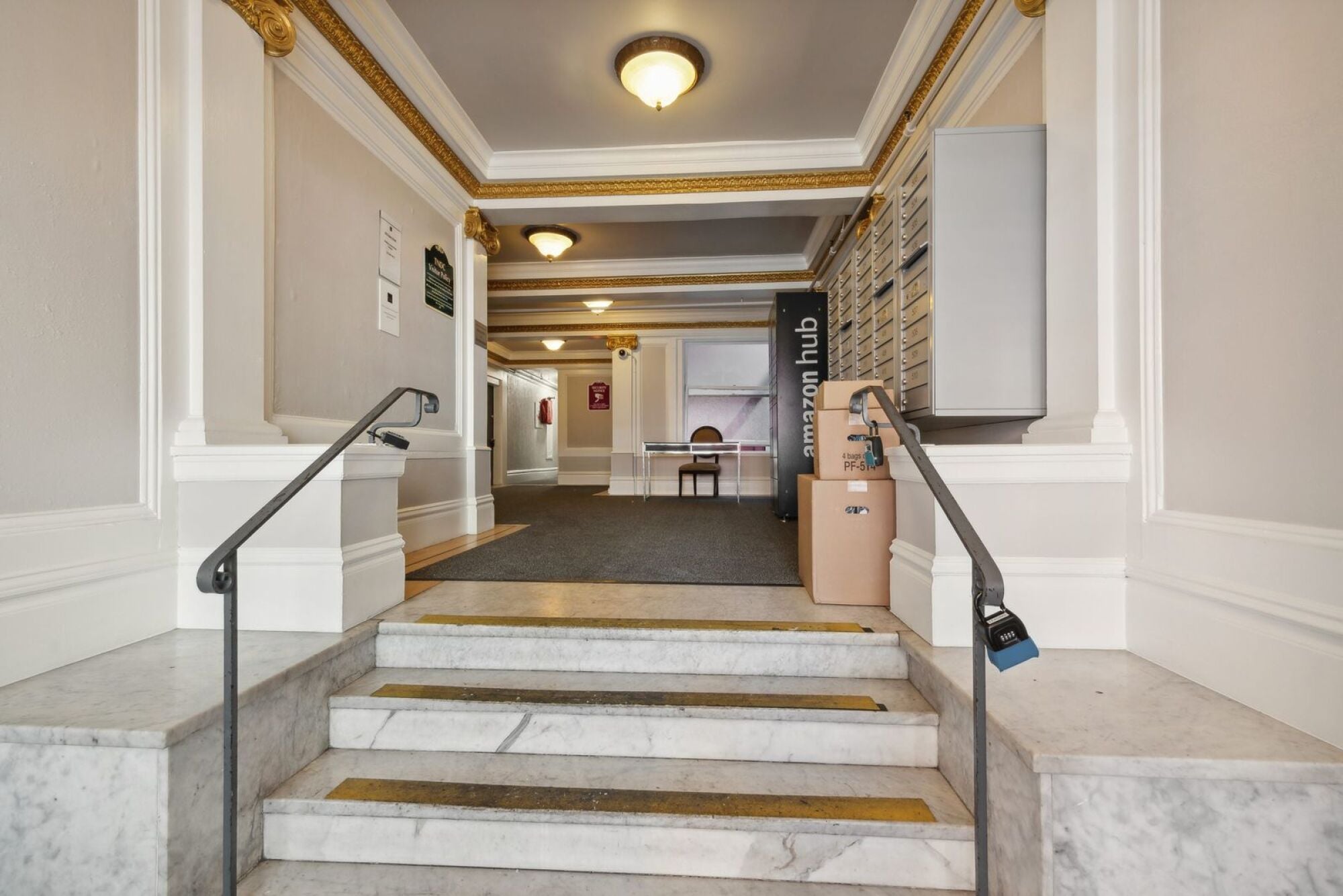 A hallway with a sign that says "Marriott Hub" on the wall.
