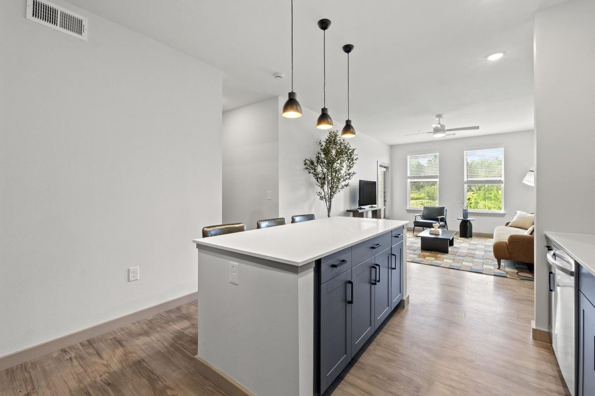Spacious Living Area with Large Kitchen Island in Austin TX