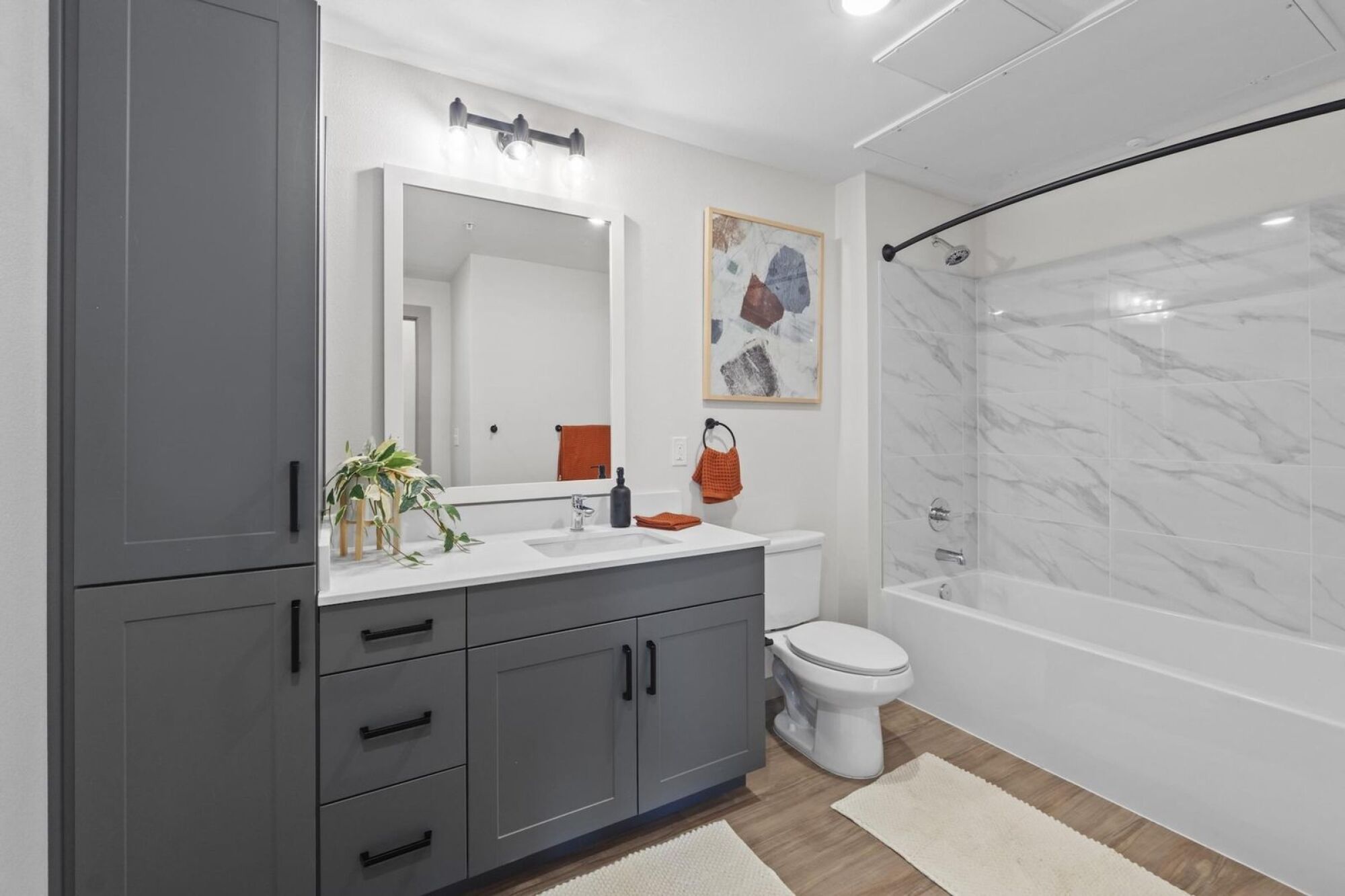 Bathroom with built-in storage and dark grey cabinetry in Austin TX