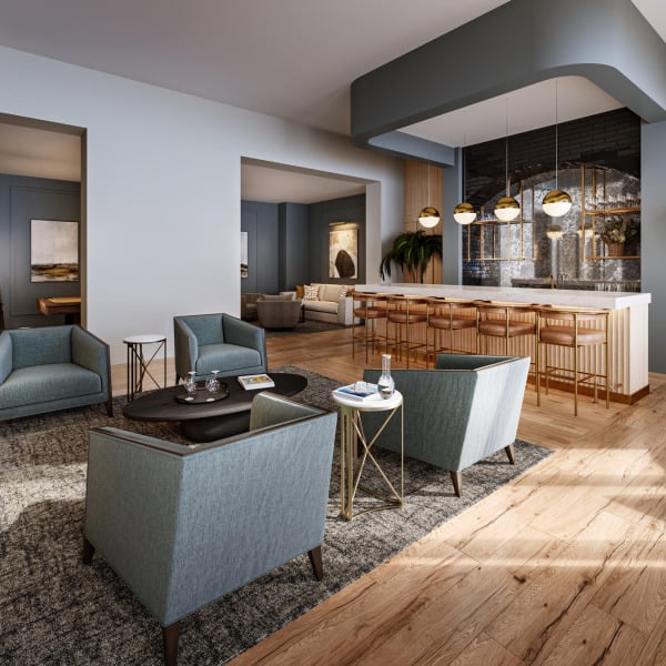 A living room with a bar and chairs.