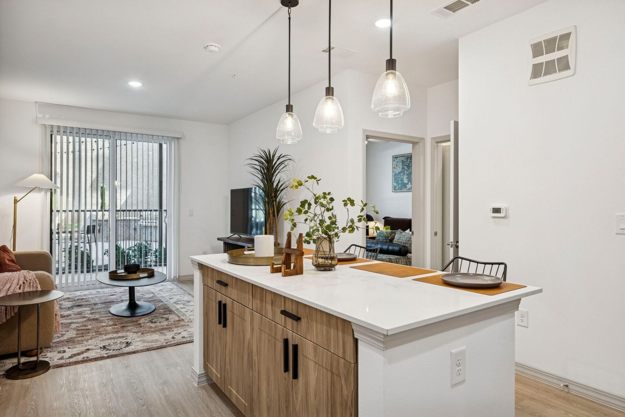 Open-concept kitchen with stainless steel appliances at The Elara near Dallas, TX