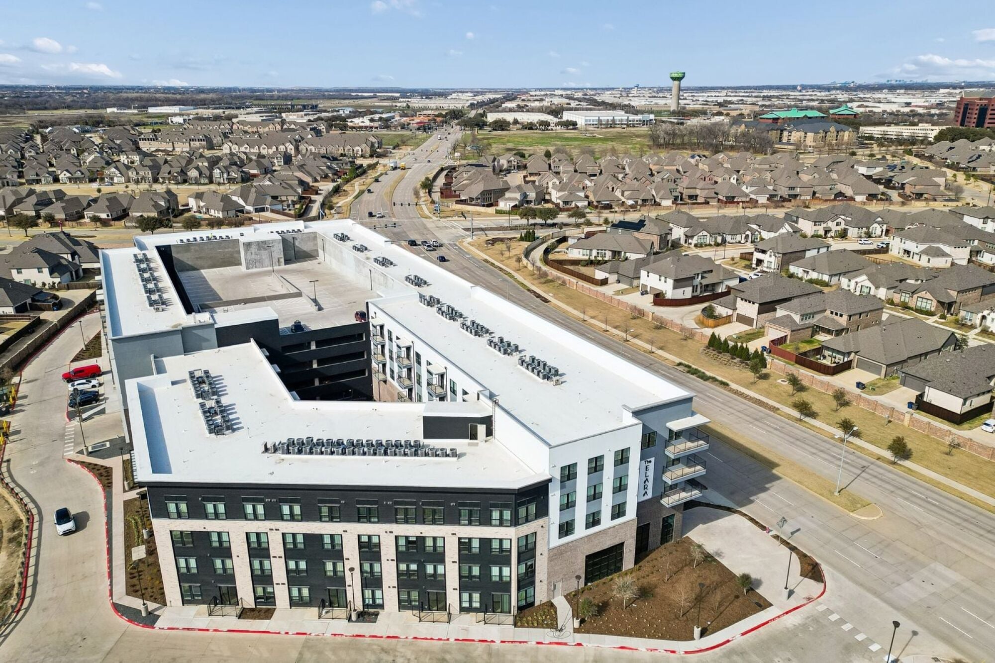 Exterior view of The Elara Apartments in Farmers Branch, TX