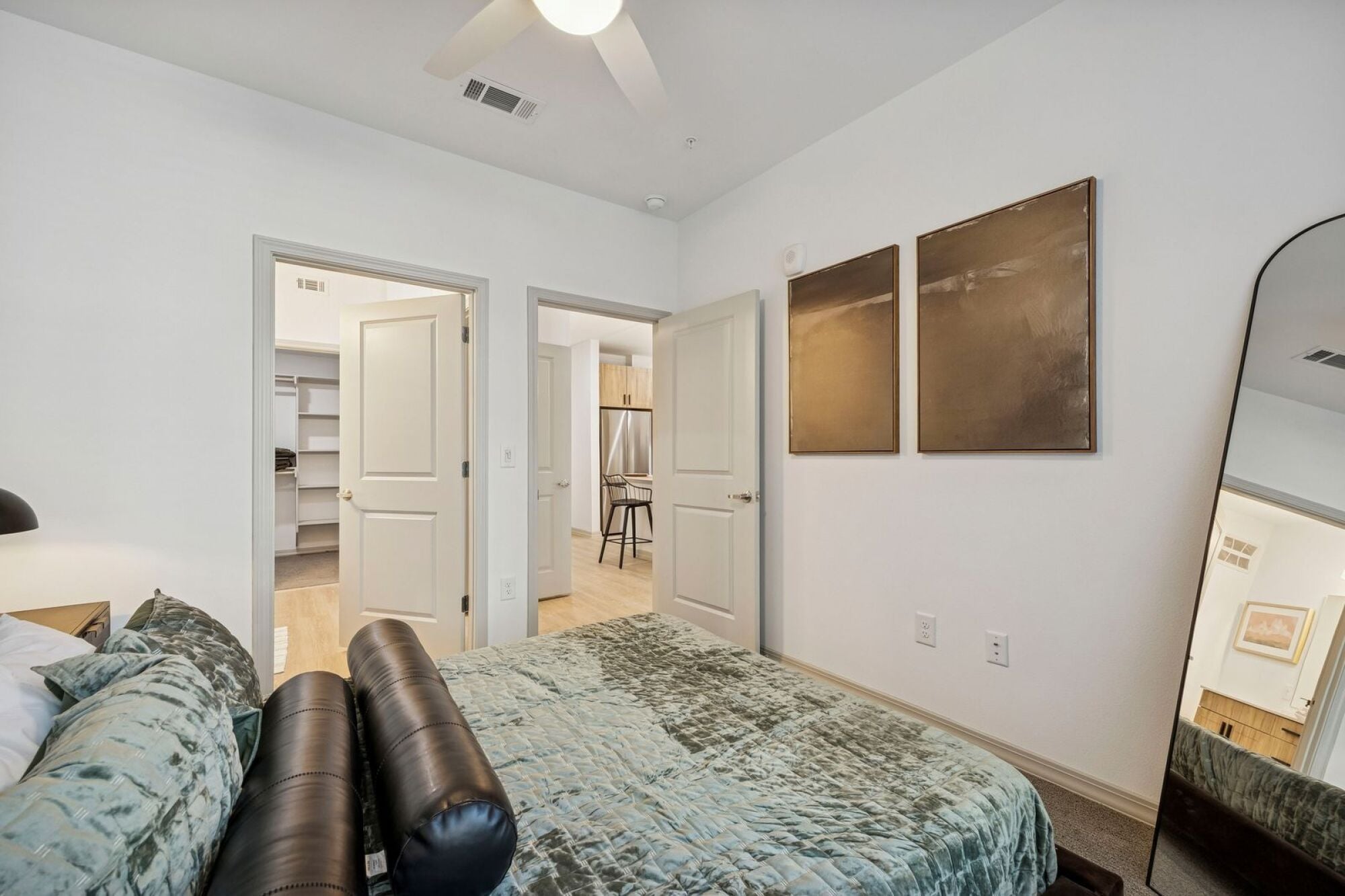 Modern apartment bedroom with ceiling fan at The Elara near Dallas, TX