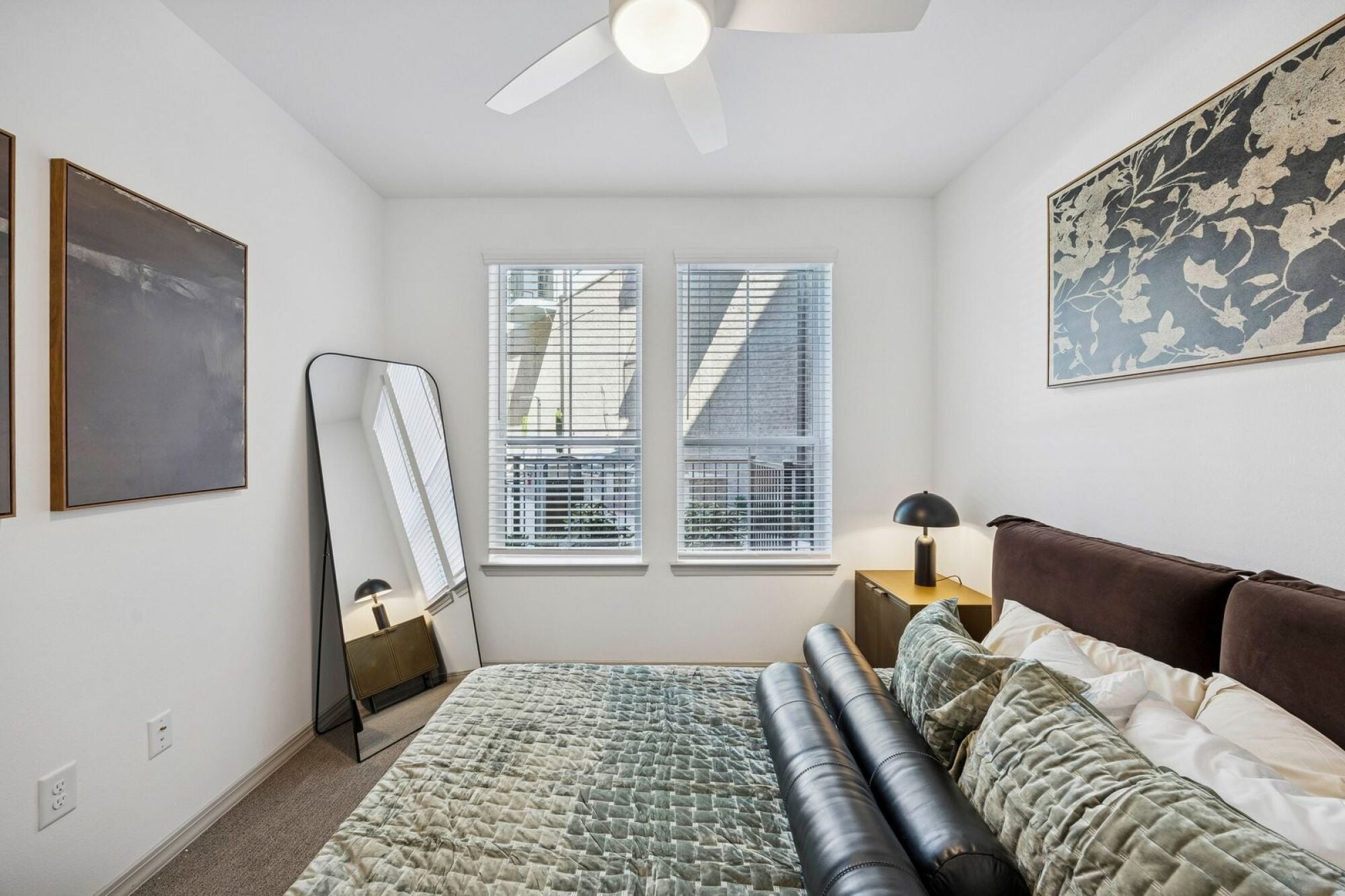 Spacious bedroom at The Elara Apartments in Farmers Branch, TX with natural light and modern finishes near Dallas, TX