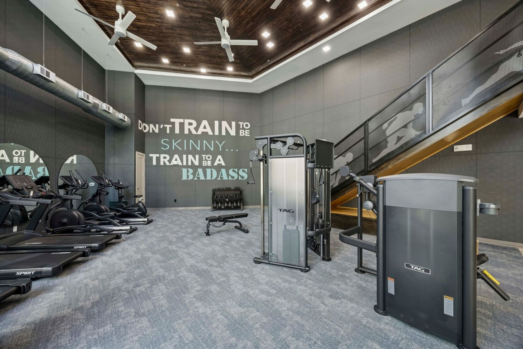 Multi-level fitness center at The Elara in Farmers Branch, TX with expansive workout areas and state-of-the-art equipment near Dallas