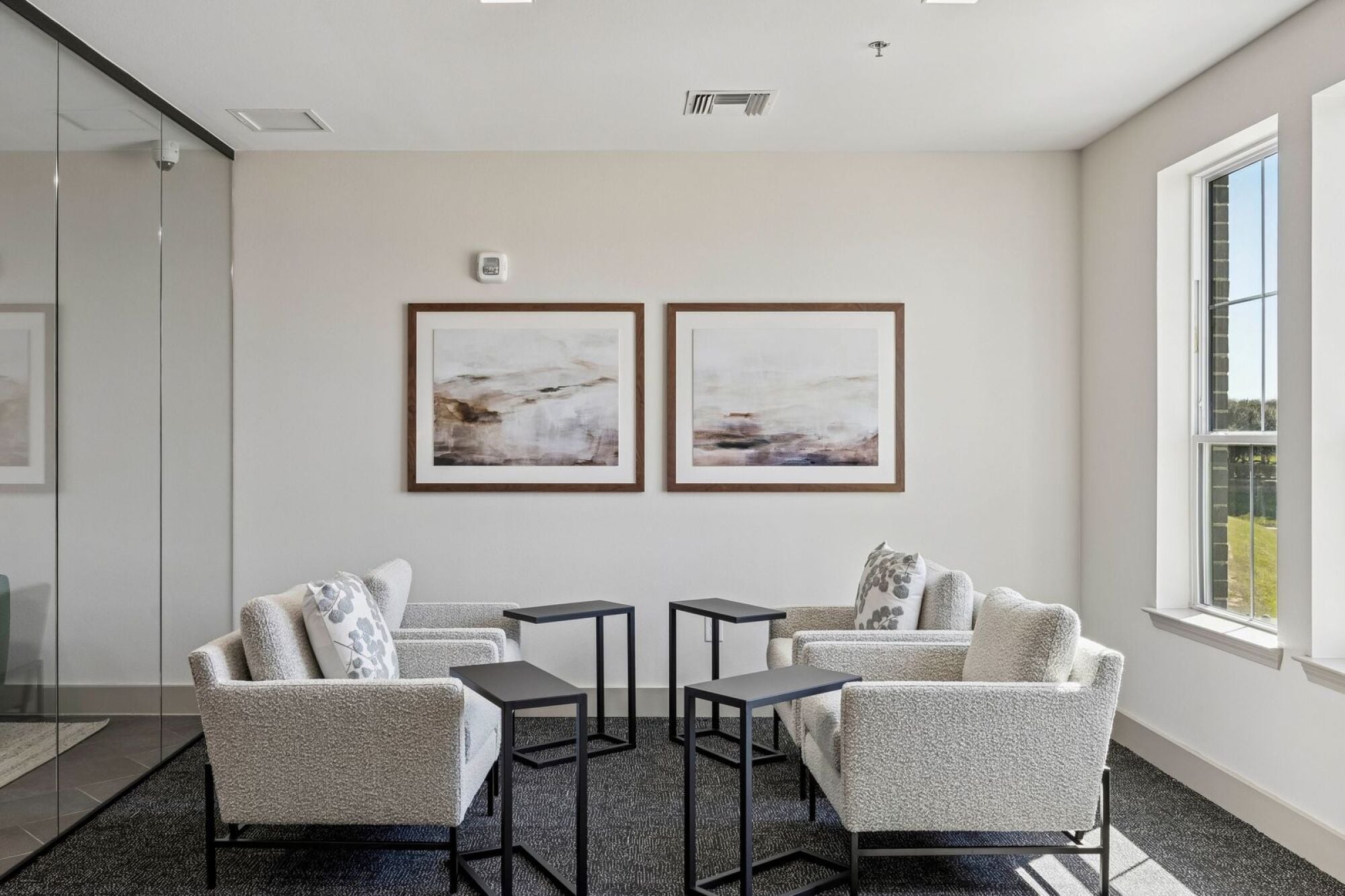 Modern resident conference room at The Elara Apartments near Dallas, TX offering private meeting space in Farmers Branch, TX