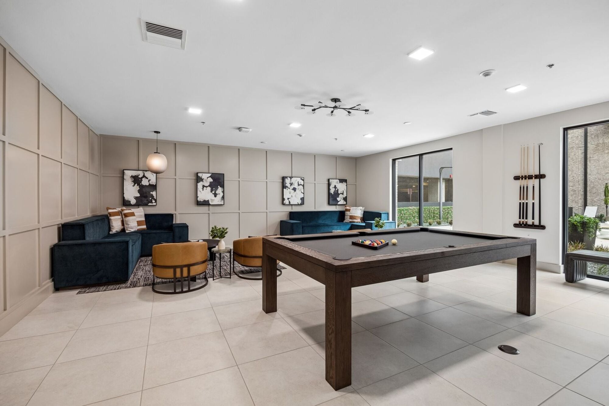 Spacious clubroom at The Elara in Farmers Branch, TX featuring a pool table and inviting community atmosphere near Dallas, TX