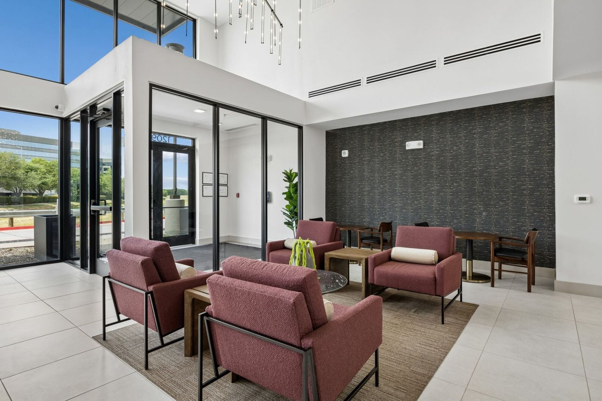 Modern lobby at The Elara in Farmers Branch, TX featuring upscale finishes and welcoming resident entry near Dallas, TX