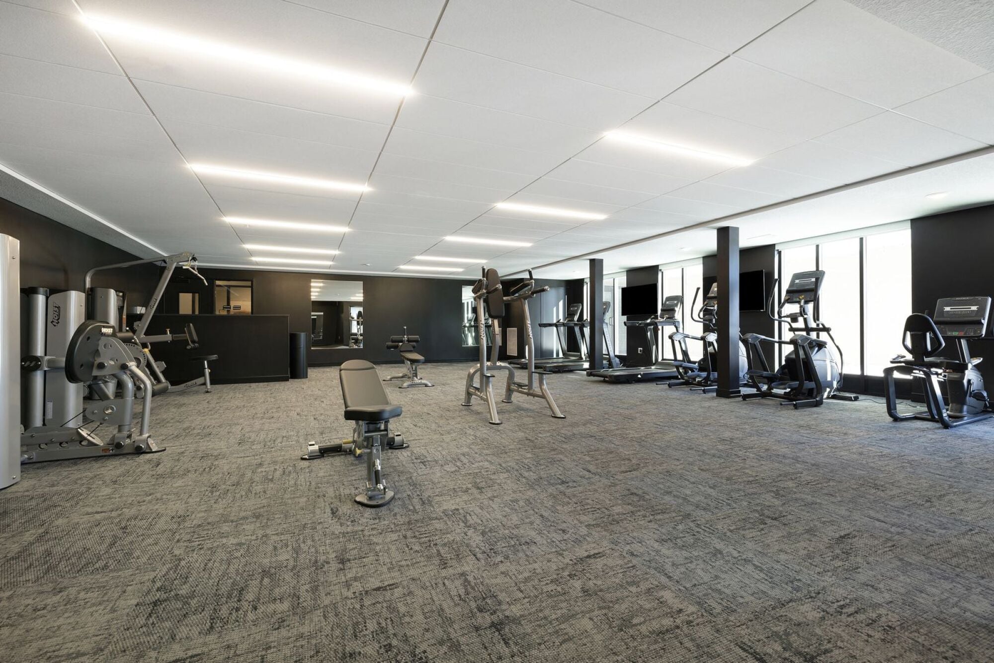 A spacious gym with a variety of equipment at The Blakeley in Shakopee, MN.