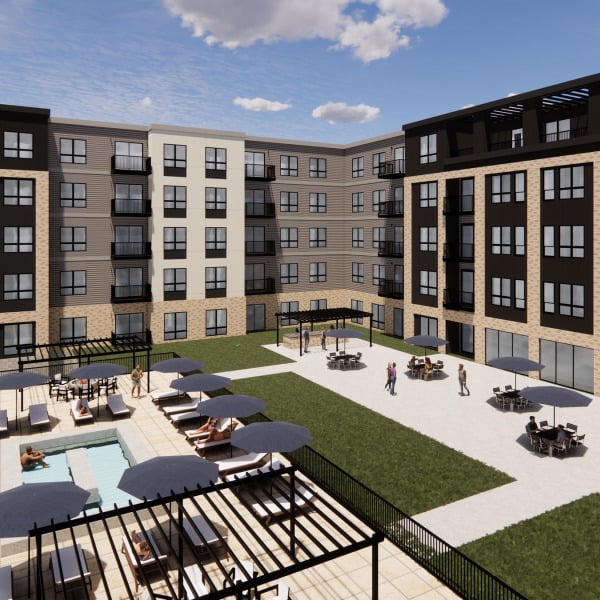 Modern apartment complex with balconies, pool, lounge chairs, and people socializing in a grassy courtyard.