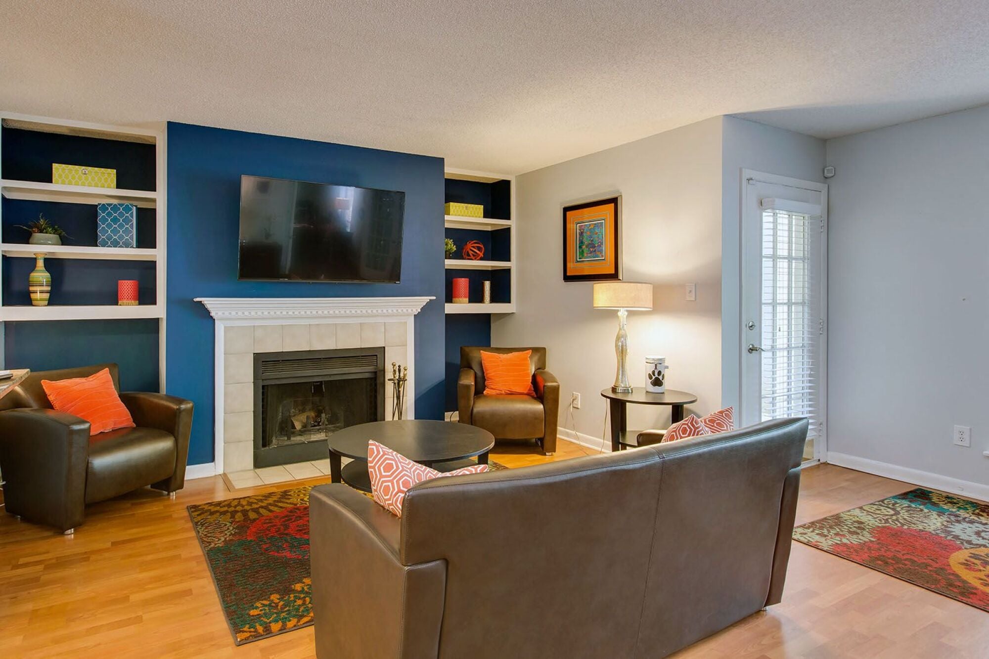 Resident Lounge with fireplace, seating, tv at Laurel Oaks, Raleigh, North Carolina