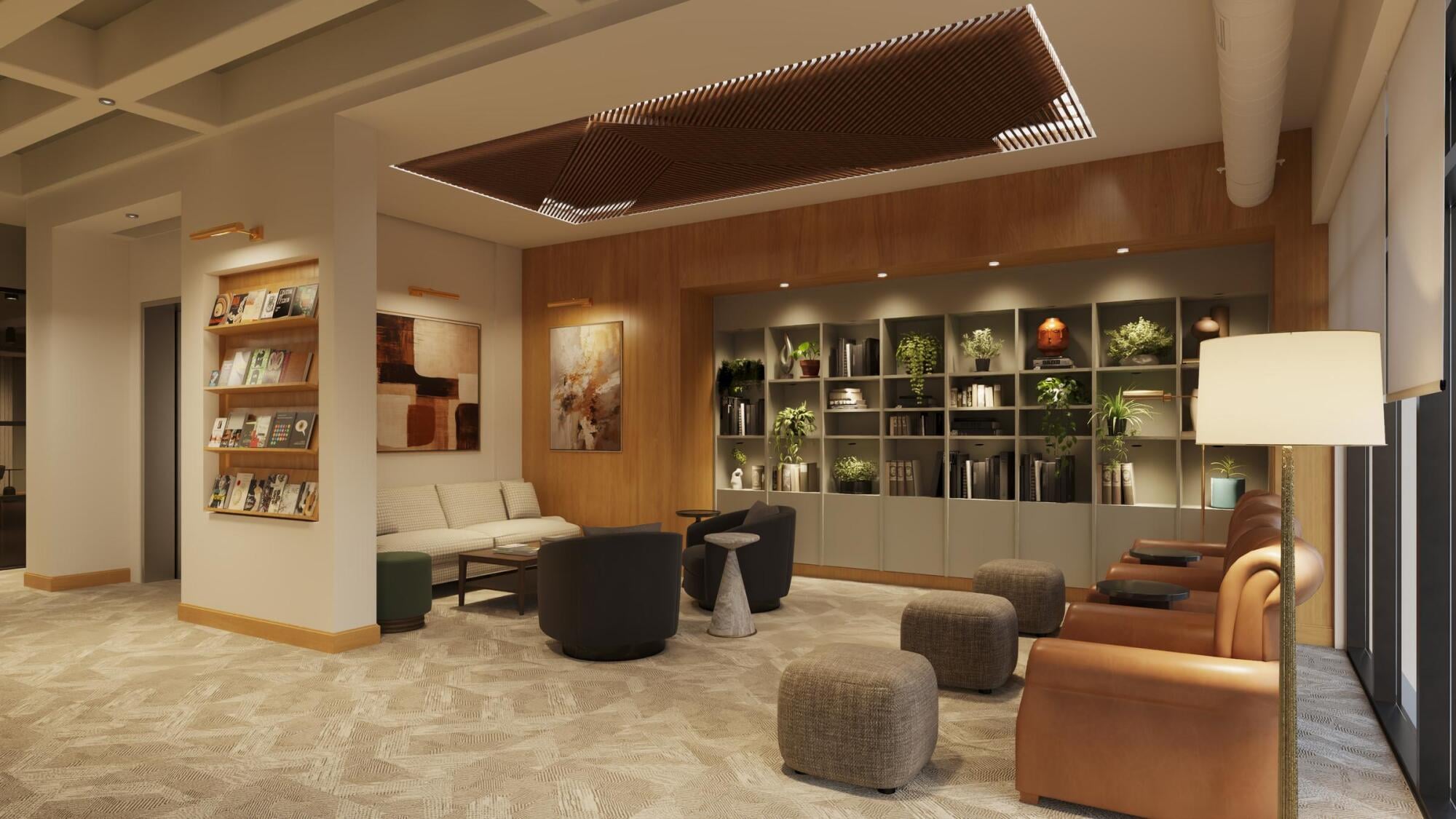 Sonder A lobby featuring a large bookcase filled with books and several comfortable chairs arranged for seating.