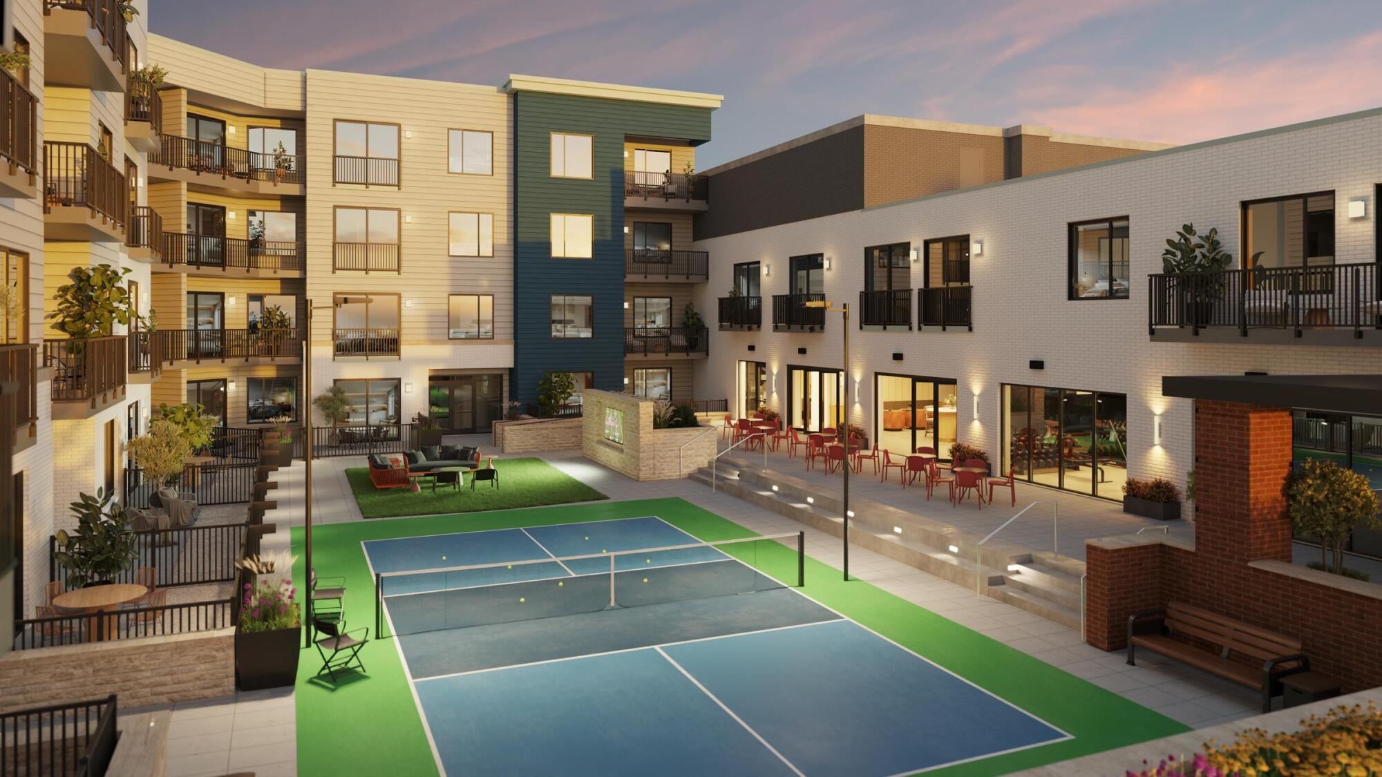 Sonder View of an apartment complex with well-maintained tennis courts and a sparkling swimming pool.
