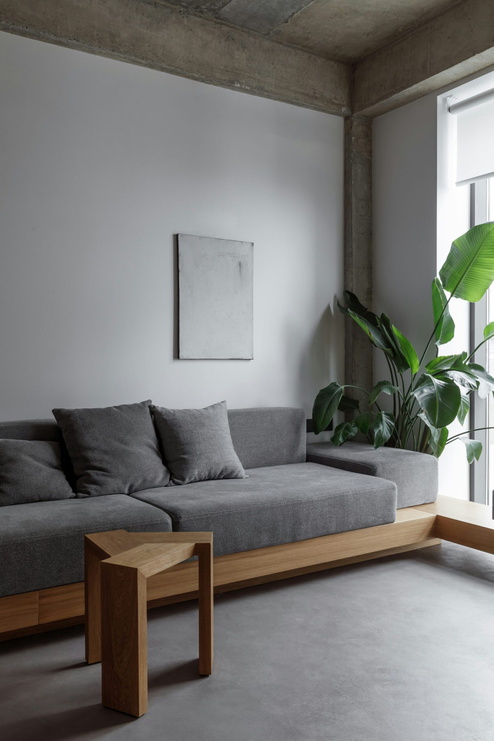 The Wade A cozy living room featuring a couch, coffee table, and a television against a neutral wall.