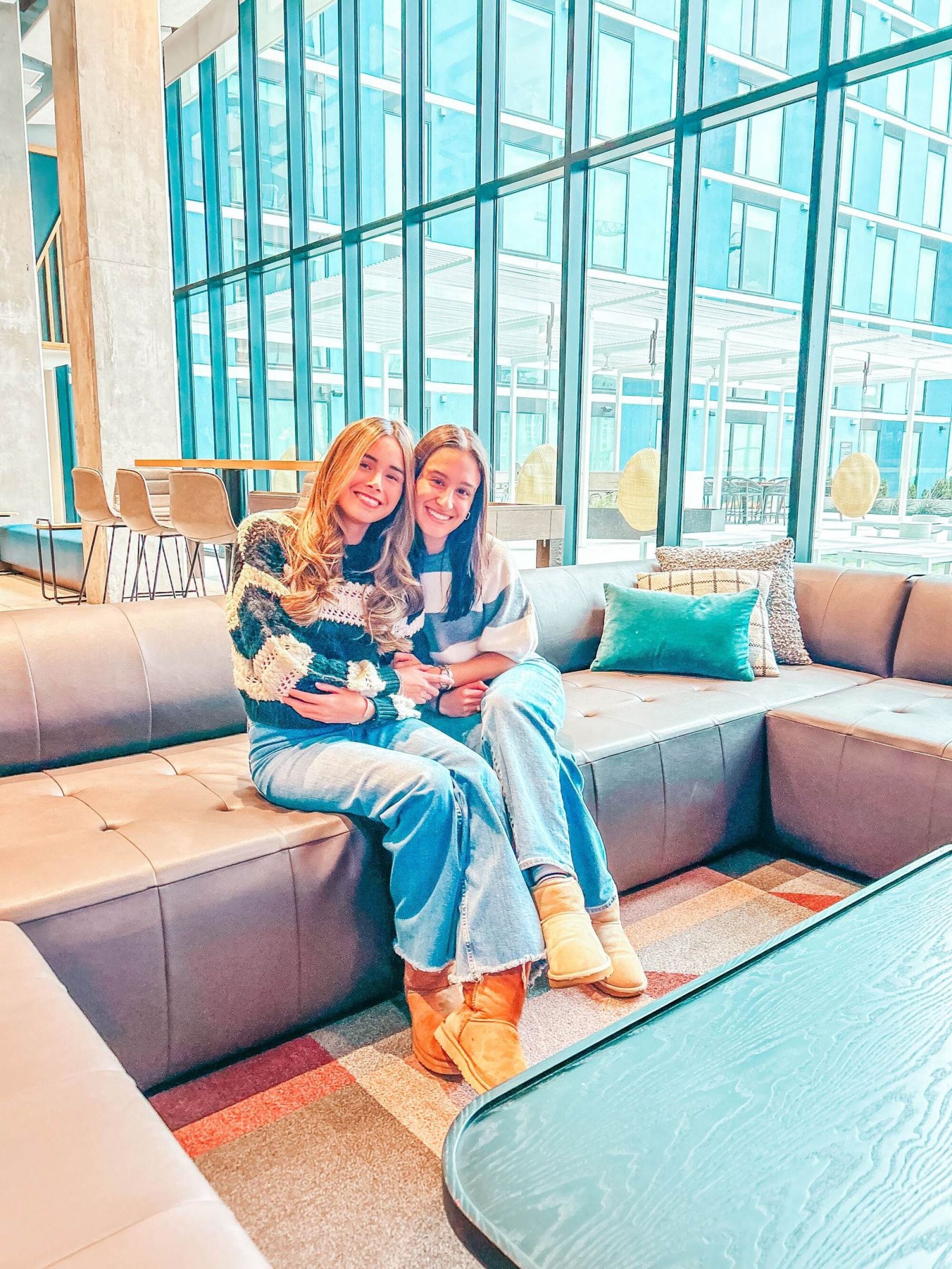 Friends on the sectional in the resident lounge at Rev in College Station, TX.