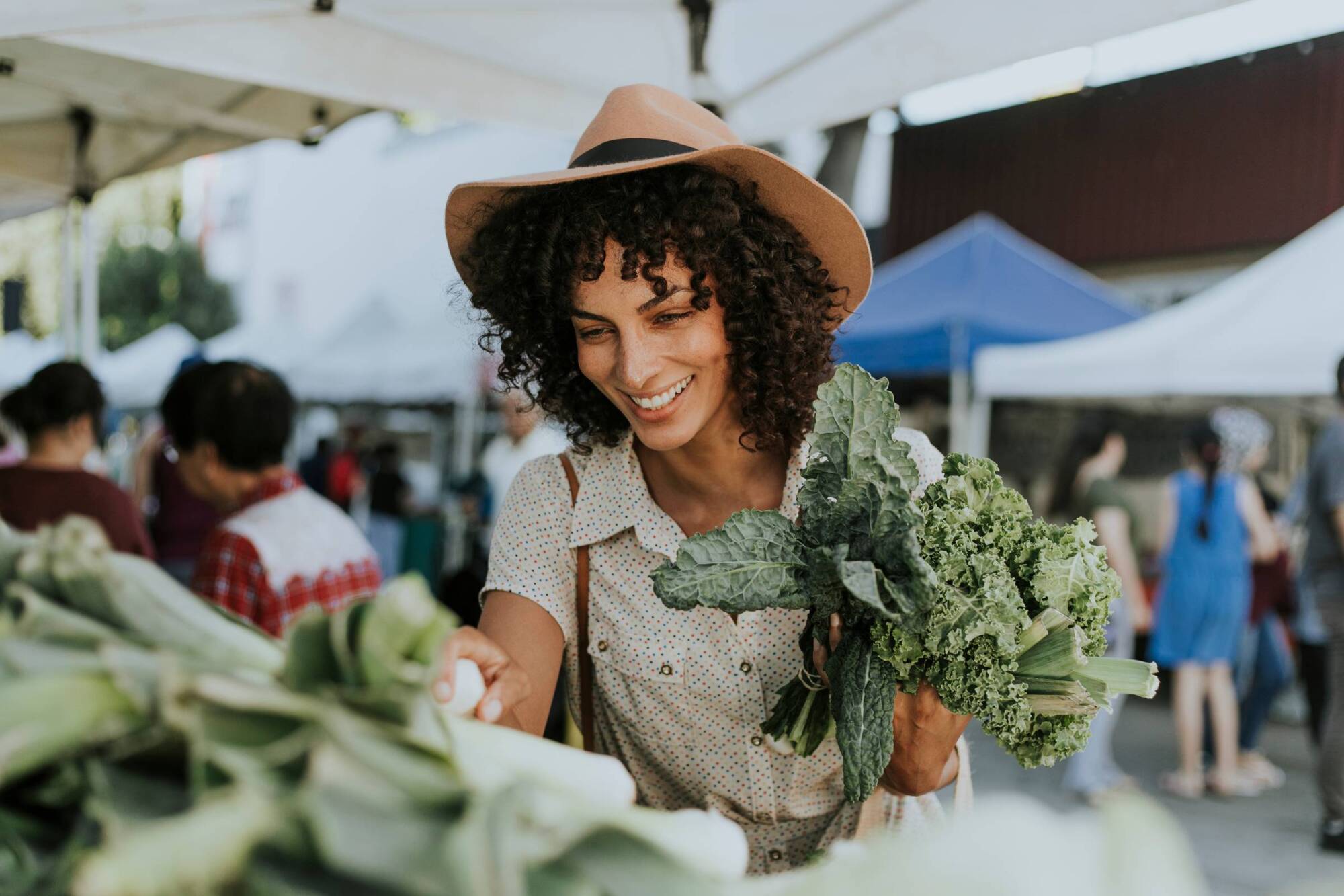 Shopping at a local farmers market near Allers Landing apartments in Austin, Texas