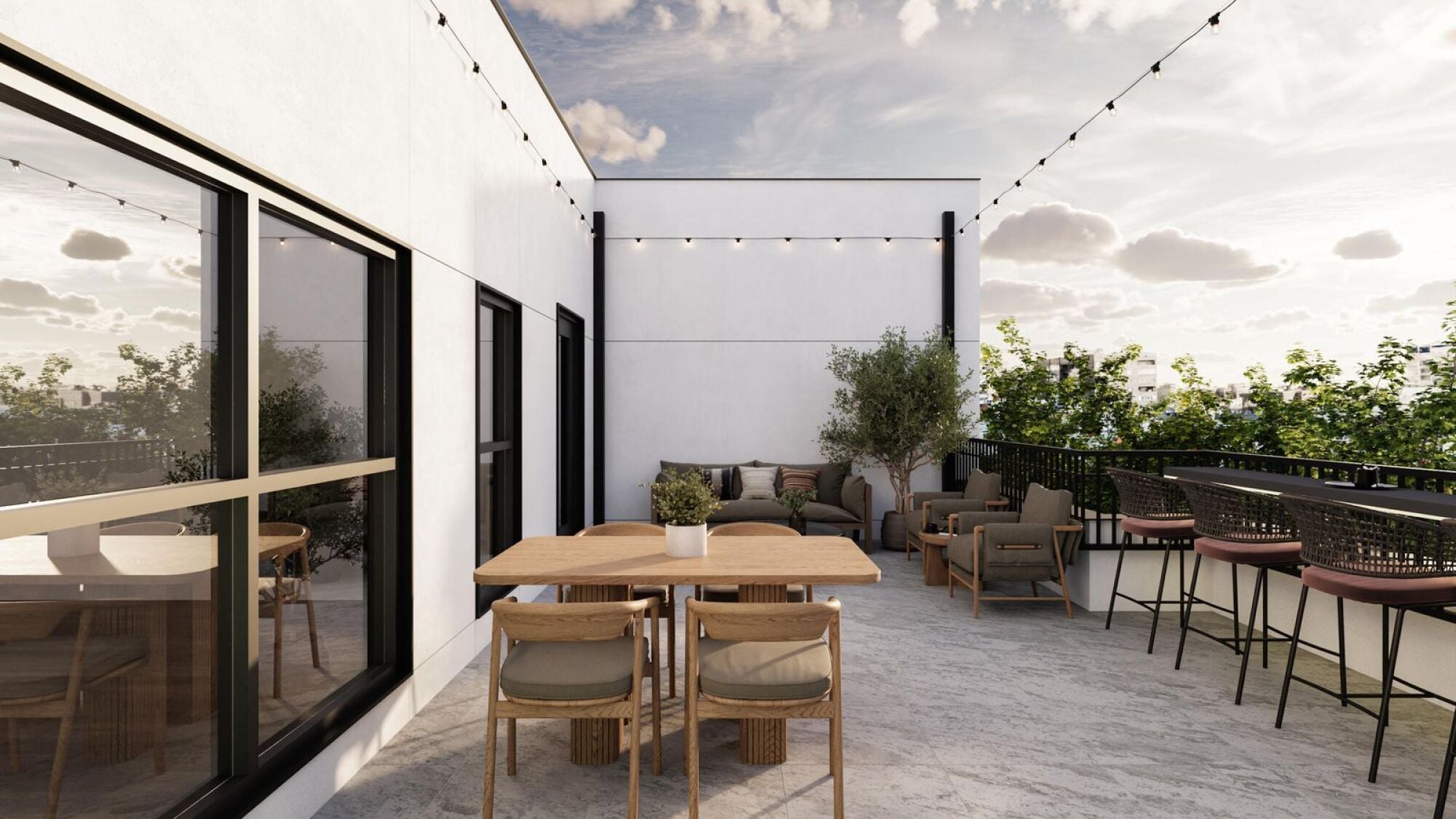 Modern outdoor patio with wooden tables, chairs, lounge seating, string lights, and potted plants.