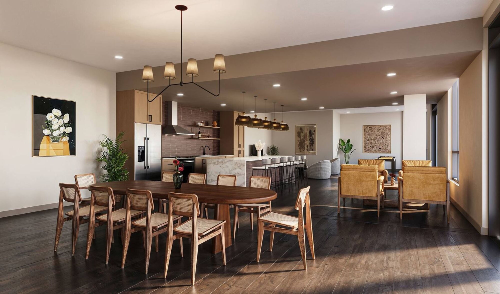Modern open-plan dining and kitchen area with wooden furniture, pendant lights, and large windows.