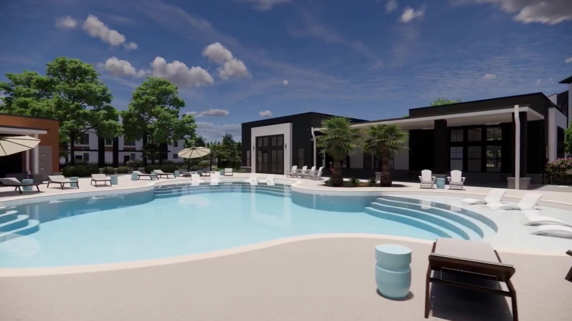 A modern outdoor pool with lounge chairs, umbrellas, palm trees, and contemporary buildings under a blue sky.