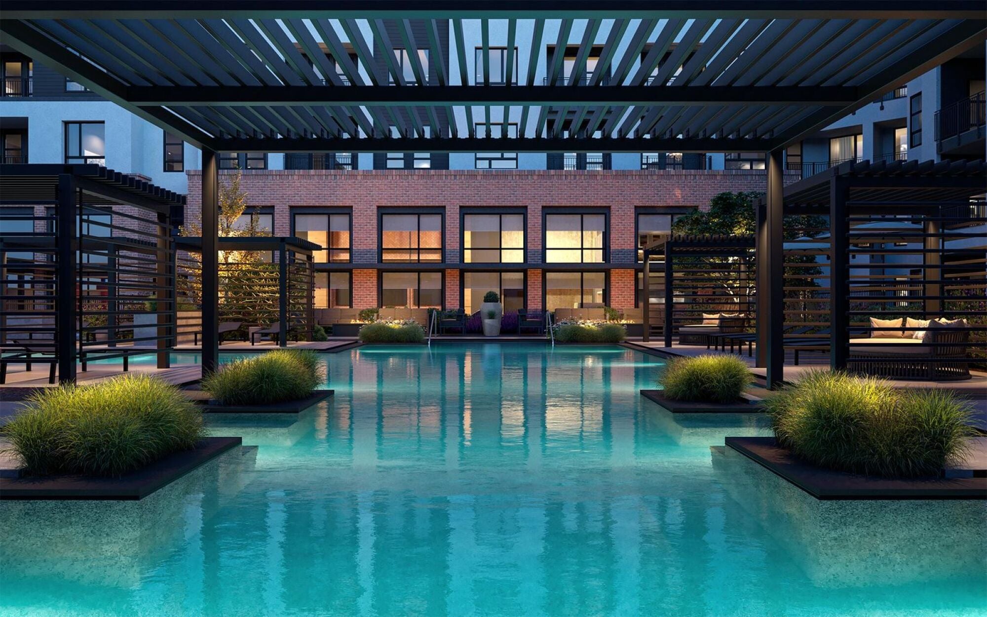 Tranquil outdoor pool area at Solana Central Park with surrounding seating and a firepit under a modern pergola.