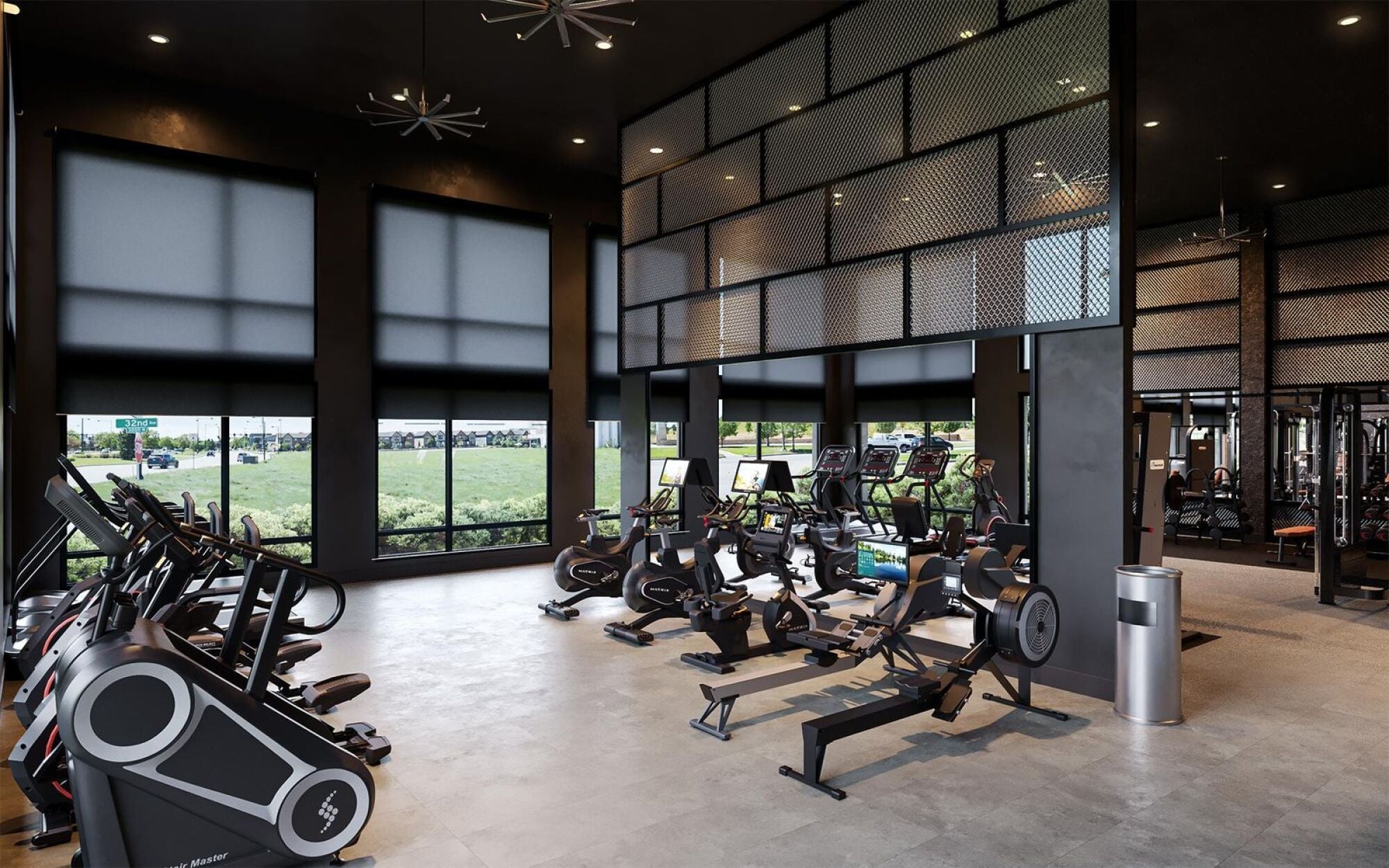 State-of-the-art gym at Solana Central Park featuring cardio machines and weights in a high-ceilinged room.
