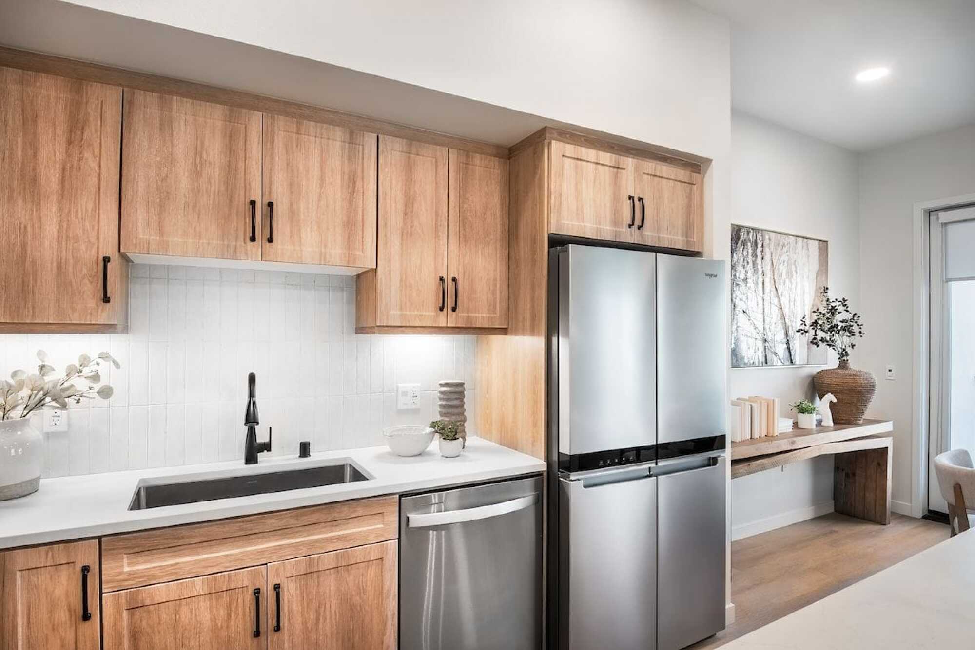 Kitchen with stainless steel appliances at Solana Winchester Hills Temecula apartments.