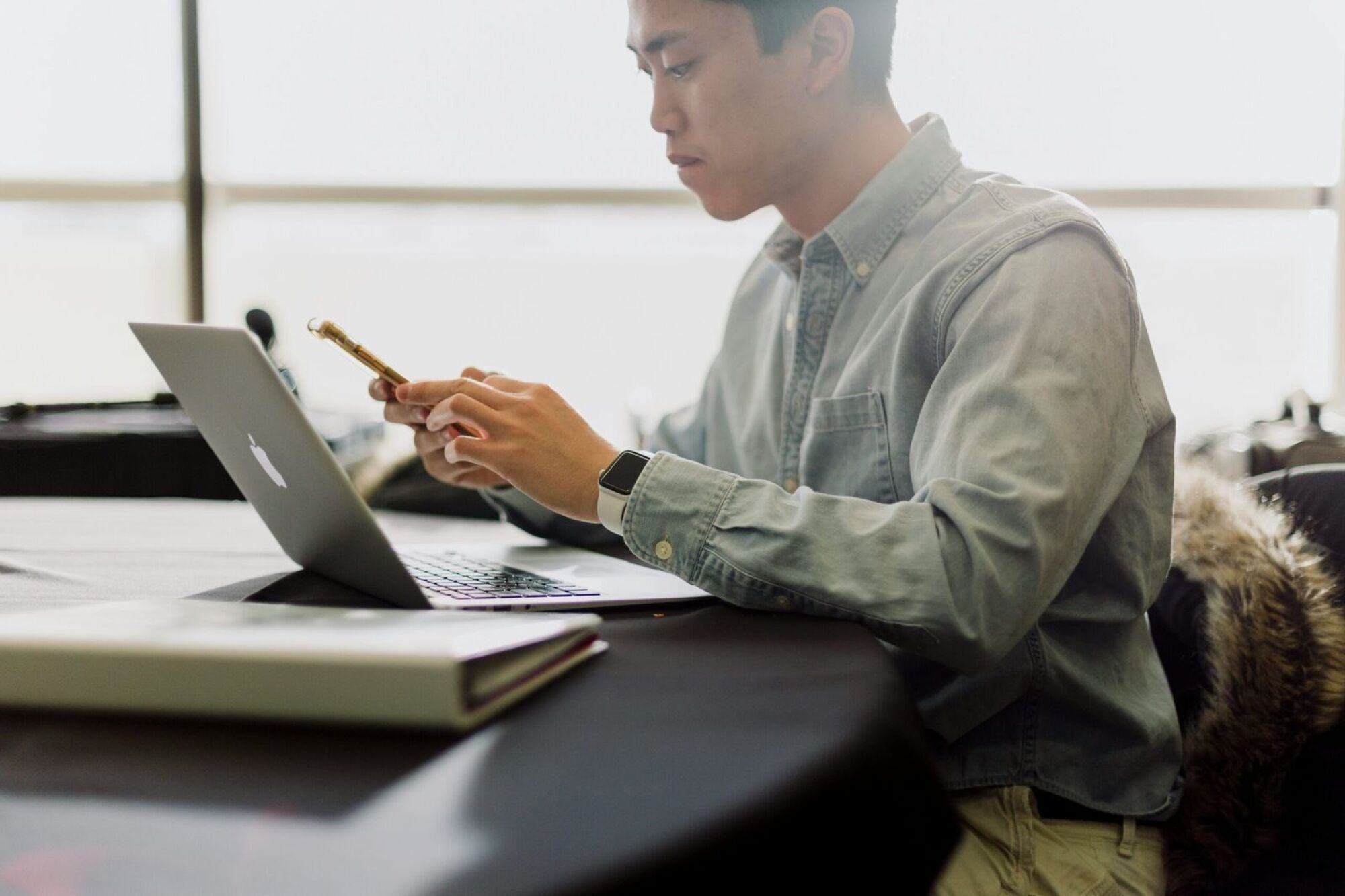 Man working on laptop in coworking space
