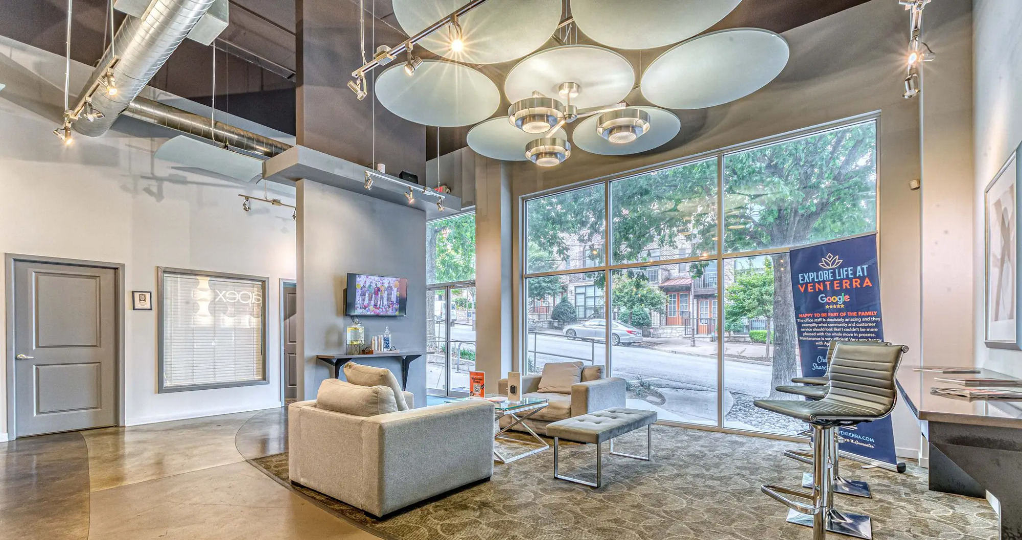Apex West Midtown front lobby with modern seating and window light