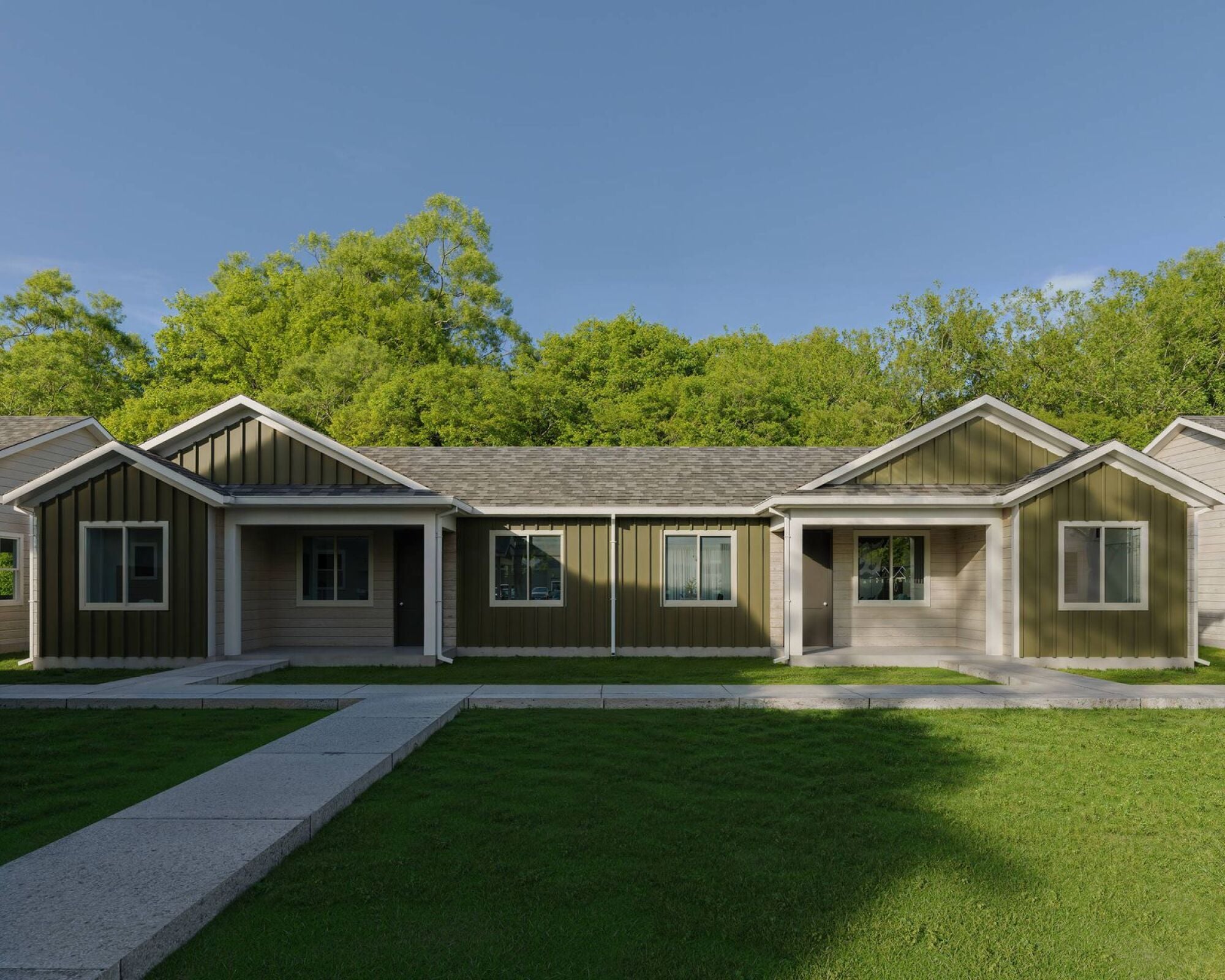 Landmark on Scioto in Columbus, Ohio, with a row of single-story homes framed by lawns and mature trees.